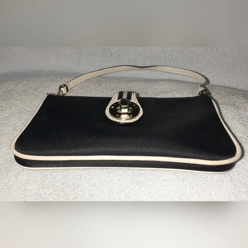 Michael Kors black canvas with cream leather trim and handle.
